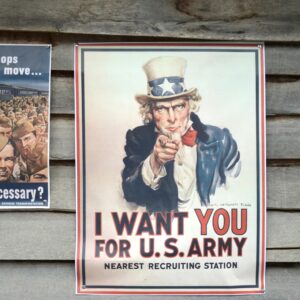 Vintage US Army recruitment poster featuring Uncle Sam on a wooden wall.
